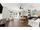 Bright living room with hardwood floors and natural light from the windows at 3110 John Anderson Dr, Ormond Beach, FL 32176