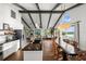 Bright living space and kitchen boasts wood floors, modern finishes, and plenty of natural light at 3110 John Anderson Dr, Ormond Beach, FL 32176
