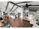 Open living space showing the kitchen and living area with wood-look flooring at 3110 John Anderson Dr, Ormond Beach, FL 32176