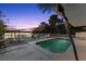 Beautiful backyard with a refreshing pool, spacious deck, and calming waterfront views at 3110 John Anderson Dr, Ormond Beach, FL 32176