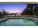 Stunning outdoor pool with waterfront views and comfortable seating for relaxation at 3110 John Anderson Dr, Ormond Beach, FL 32176