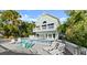 Backyard pool with ample seating, lounge chairs, and an upper balcony at 3110 John Anderson Dr, Ormond Beach, FL 32176