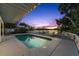 Beautiful backyard with a refreshing pool, spacious deck, and calming waterfront views at 3110 John Anderson Dr, Ormond Beach, FL 32176