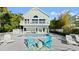 Backyard pool with ample seating, lounge chairs, and an upper balcony at 3110 John Anderson Dr, Ormond Beach, FL 32176