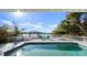 Sparkling pool with waterfront views and inviting lounge area at 3110 John Anderson Dr, Ormond Beach, FL 32176