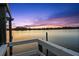 Gorgeous sunset view from the dock with serene water and stunning twilight sky backdrop at 3110 John Anderson Dr, Ormond Beach, FL 32176