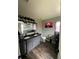 Bathroom with a double sink vanity, modern lighting, grey walls and dark wood grain flooring at 3339 Croton Ave, Deltona, FL 32738