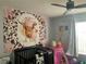 Charming Bedroom with unique cow-themed decor and a cozy crib at 3339 Croton Ave, Deltona, FL 32738