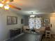 Spacious game room featuring a pool table, comfortable chairs, and access to the front door at 3339 Croton Ave, Deltona, FL 32738