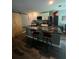 Beautiful kitchen featuring a marble island, modern appliances, white cabinetry and barn door access at 3339 Croton Ave, Deltona, FL 32738