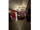 Spacious main bedroom featuring wood floors, red walls and a tray ceiling with fan at 3339 Croton Ave, Deltona, FL 32738