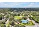 Aerial view highlighting the community park, tennis courts, and playground area at 3988 Radley Ct, Longwood, FL 32779