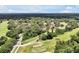 Aerial view showcasing community's beautiful golf course surrounded by green spaces and homes at 3988 Radley Ct, Longwood, FL 32779