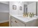 Elegant bathroom features a white vanity with modern gold hardware, stylish decor, and a large mirror at 3988 Radley Ct, Longwood, FL 32779