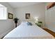 Bright bedroom featuring a bed with decorative pillows, a window with shutters, and stylish side tables at 3988 Radley Ct, Longwood, FL 32779
