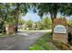 Welcome to Wekiva Hunt Club Condominiums, featuring a well-manicured entrance, lush trees, and picturesque surroundings at 3988 Radley Ct, Longwood, FL 32779