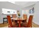 Cozy dining area with a round glass table, comfortable chairs, and neutral decor offering an inviting space for meals at 3988 Radley Ct, Longwood, FL 32779