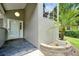 Inviting entrance featuring a new front door, fresh paint, stylish flooring, and lush landscaping at 3988 Radley Ct, Longwood, FL 32779