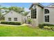 Charming home featuring a landscaped yard and stucco exterior, with an arched window and lovely curb appeal at 3988 Radley Ct, Longwood, FL 32779