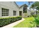 Home featuring a landscaped yard and stucco exterior, with an arched window and lovely curb appeal at 3988 Radley Ct, Longwood, FL 32779
