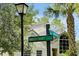 Street sign view showing lush greenery, the exterior of the property, and the neighborhood street names at 3988 Radley Ct, Longwood, FL 32779