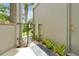 Welcoming outdoor patio with a small garden, stylish tiles, and gate access to the yard at 3988 Radley Ct, Longwood, FL 32779