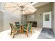 Charming patio with an umbrella table, four chairs, and outdoor plant boxes near a convenient entry at 3988 Radley Ct, Longwood, FL 32779