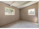 Neutral bedroom featuring large windows and carpet flooring at 442 Dorothy Ave, Daytona Beach, FL 32117