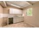 Unfinished Kitchen featuring white cabinets, tiled backsplash, and sleek countertops at 442 Dorothy Ave, Daytona Beach, FL 32117