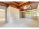 Spacious living area with wood ceiling, large windows and neutral carpet flooring at 442 Dorothy Ave, Daytona Beach, FL 32117