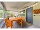 Screened-in porch featuring a dining table set with seating for six offering an inviting outdoor living space at 442 Dorothy Ave, Daytona Beach, FL 32117