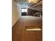 Spacious attic with exposed insulation and beams, offering potential for storage or conversion at 79 Cypress Pond Rd # 79, Port Orange, FL 32128