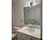Modern bathroom features a sink with marble counters, a contemporary faucet and a large mirror at 79 Cypress Pond Rd # 79, Port Orange, FL 32128