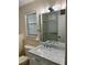 Bathroom featuring a vanity with marble countertop, a sink, a toilet and a shower at 79 Cypress Pond Rd # 79, Port Orange, FL 32128