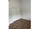 A clean bedroom with wood-look floors and a large closet at 79 Cypress Pond Rd # 79, Port Orange, FL 32128