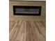 Close up of a modern electric fireplace with attractive floors at 79 Cypress Pond Rd # 79, Port Orange, FL 32128