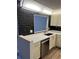 Kitchen featuring black marble tile backsplash, stainless steel appliances, and cream colored cabinets at 79 Cypress Pond Rd # 79, Port Orange, FL 32128