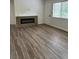 Open-concept living room with stylish floors and modern electric fireplace at 79 Cypress Pond Rd # 79, Port Orange, FL 32128