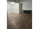 Spacious living room showcasing a modern electric fireplace and attractive floors at 79 Cypress Pond Rd # 79, Port Orange, FL 32128