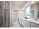 Bathroom with double vanity, large shower, and walk-in closet at 2175 Aibonito Cir, Clermont, FL 34711