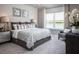Main bedroom with king-size bed and water view at 2175 Aibonito Cir, Clermont, FL 34711