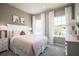 Bedroom with a queen-size bed and plenty of natural light at 2175 Aibonito Cir, Clermont, FL 34711