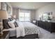 Main bedroom with king-size bed and water view at 2175 Aibonito Cir, Clermont, FL 34711