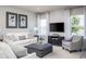 Bright living room with comfy seating and large TV at 2175 Aibonito Cir, Clermont, FL 34711
