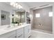 Spa-like bathroom with double vanity and a large shower at 746 Copper Creek Dr, New Smyrna Beach, FL 32168