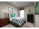 Comfortable bedroom with a green and gray plaid comforter at 746 Copper Creek Dr, New Smyrna Beach, FL 32168