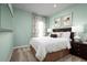 Serene bedroom with a light-colored bed and calming decor at 746 Copper Creek Dr, New Smyrna Beach, FL 32168