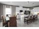 Bright kitchen featuring an island and dining area at 746 Copper Creek Dr, New Smyrna Beach, FL 32168