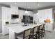 Modern kitchen with white cabinets, stainless steel appliances, and an island with seating at 746 Copper Creek Dr, New Smyrna Beach, FL 32168