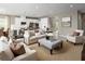 Open concept living room and kitchen with neutral decor and ample natural light at 746 Copper Creek Dr, New Smyrna Beach, FL 32168